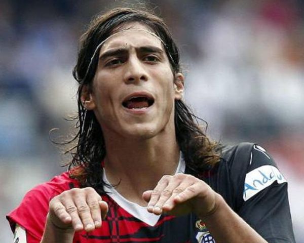 Martin Caceres soccer player with long hair