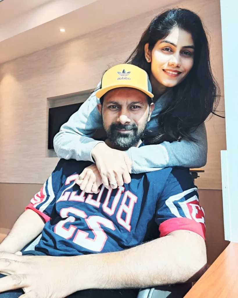 Praveen Kumar with his wife
